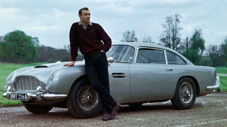 Sean Connery Next To The Aston Martin Db5 Featured In Gold Finger 1